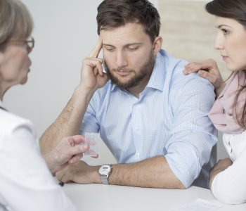 troubled couple at the doctor's 